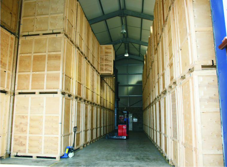 Wooden storage containers and forklift in warehouse